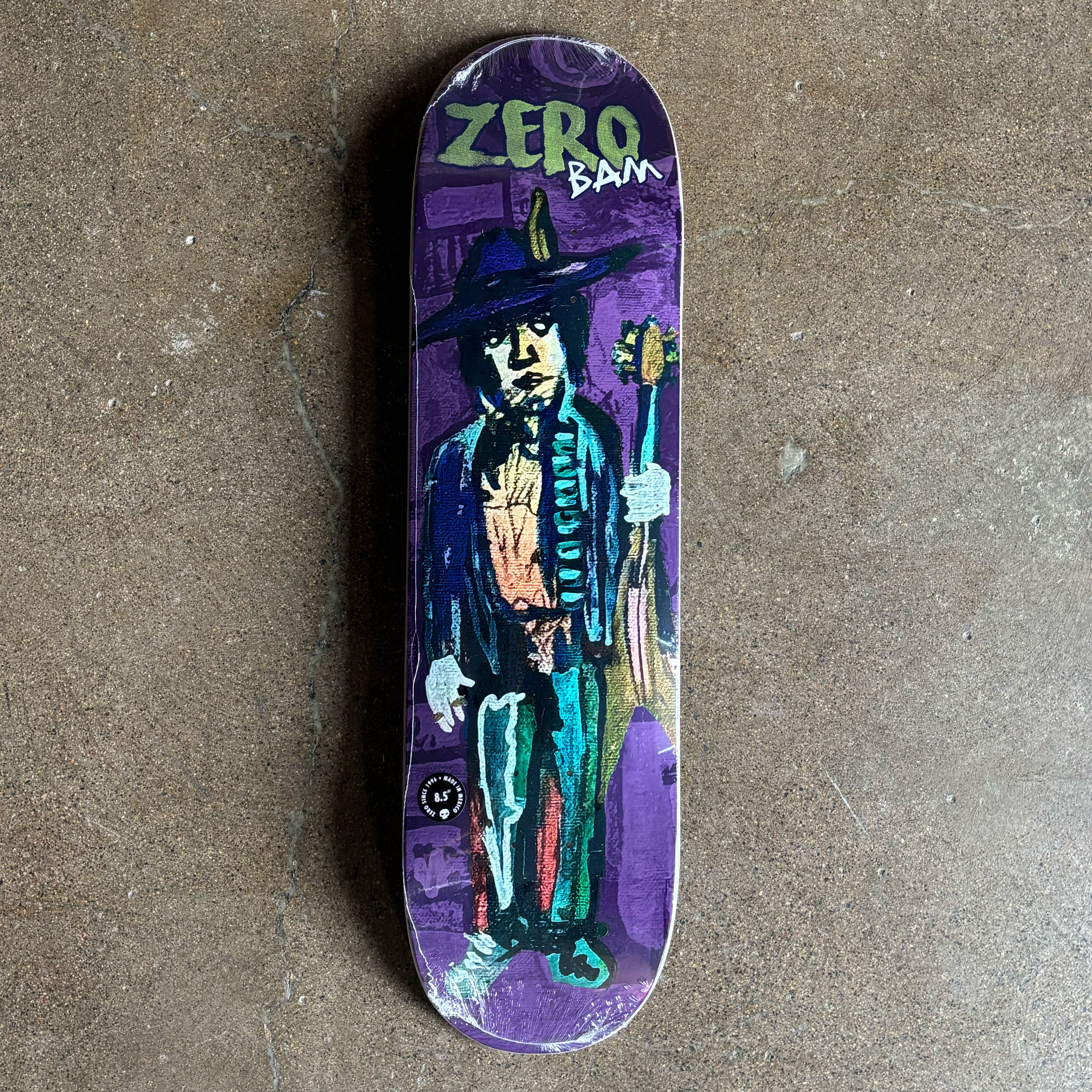 Skateboard deck with a colorful illustration of a character holding a guitar.
